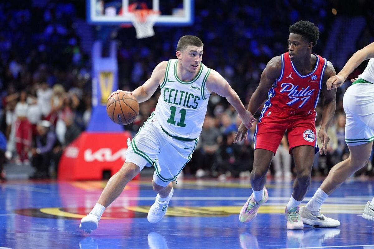 Oct 31, 2025; Philadelphia, Pennsylvania, USA; Boston Celtics guard Payton Pritchard (11) drives with the ball against Philadelphia 76ers guard VJ Edgecombe (77) in the first quarter at Xfinity Mobile Arena. Mandatory Credit: Kyle Ross-Imagn Images