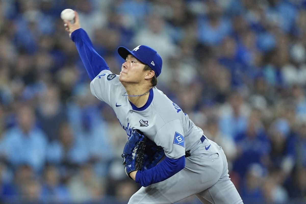Oct 31, 2025; Toronto, Ontario, CAN; Los Angeles Dodgers pitcher Yoshinobu Yamamoto (18) pitches against the Toronto Blue Jays in the sixth inning during game six of the 2025 MLB World Series at Rogers Centre. Mandatory Credit: John E. Sokolowski-Imagn Images