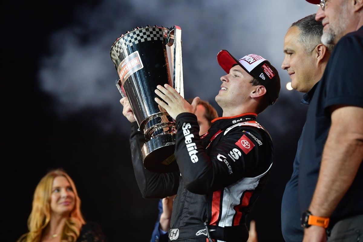 Oct 31, 2025; Avondale, Arizona, USA; NASCAR Craftsman Truck Series driver Corey Heim (11) celebrates his victory following the Truck Series Championship race at Phoenix Raceway. Mandatory Credit: Gary A. Vasquez-Imagn Images