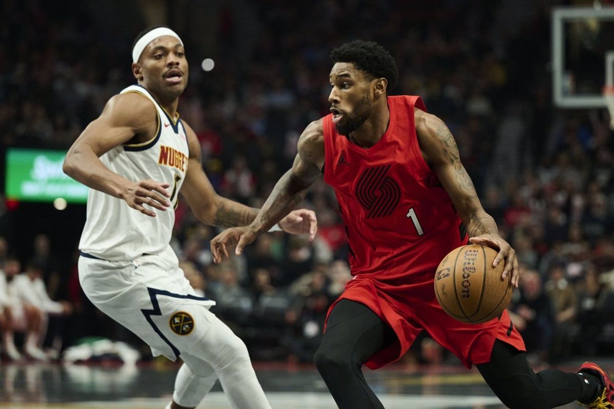 Oct 31, 2025; Portland, Oregon, USA;  Portland Trail Blazers guard Blake Wesley (1) drives to the basket during the first half against Denver Nuggets guard Bruce Brown (11) at Moda Center. Mandatory Credit: Troy Wayrynen-Imagn Images