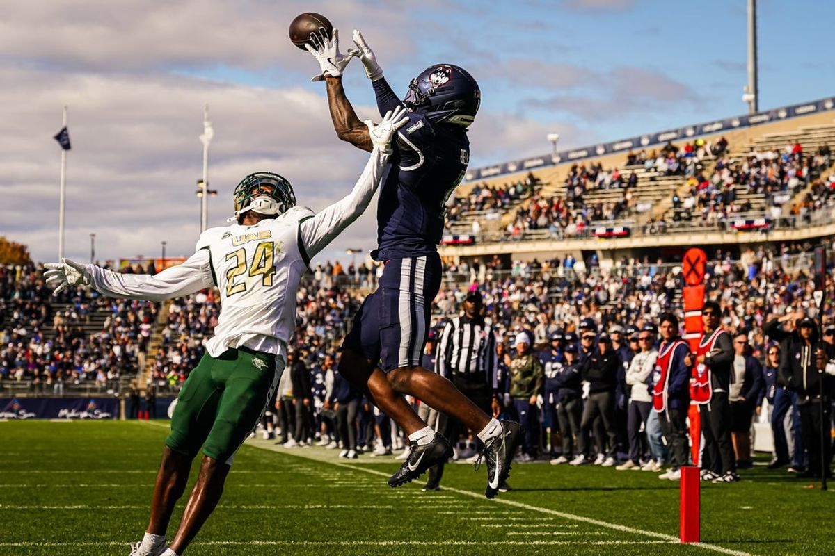 Nov 1, 2025; East Hartford, Connecticut, USA; UConn Huskies wide receiver Skyler Bell (1) makes the touchdown against UAB Blazers cornerback Tariq Watson (24) in the second quarter at Pratt & Whitney Stadium at Rentschler Field. Mandatory Credit: David Butler II-Imagn Images