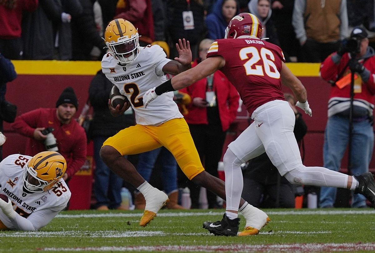 Arizona State Sun Devils quarterback Jeff Sims (2) battle for a few yards as Iowa State Cyclones' linebacker Caleb Bacon (26) attempts to tackle during the first quarter in the Big-12 showdown at jack Trice Stadium on Nov. 1, 2025, in Ames, Iowa.