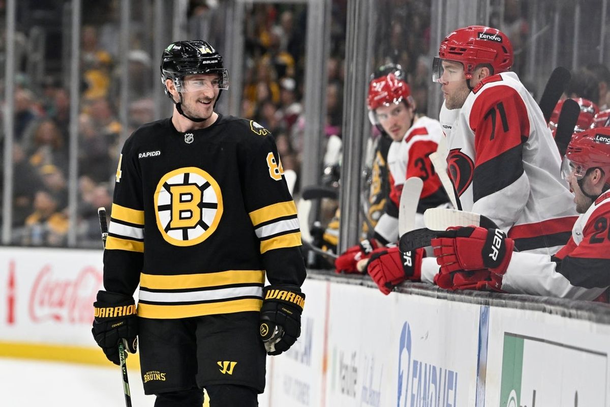 Nov 1, 2025; Boston, Massachusetts, USA; Boston Bruins left wing Tanner Jeannot (84) has words with the Carolina Hurricanes bench during the third period at TD Garden. Mandatory Credit: Eric Canha-Imagn Images