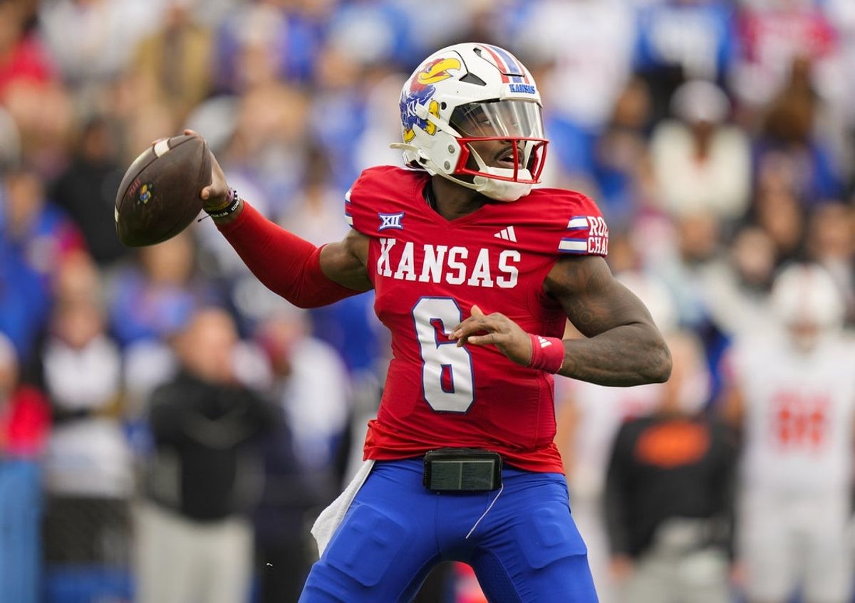 Nov 1, 2025; Lawrence, Kansas, USA; Kansas Jayhawks quarterback Jalon Daniels (6) throws a pass during the first half against the Oklahoma State Cowboys at David Booth Kansas Memorial Stadium. Mandatory Credit: Jay Biggerstaff-Imagn Images