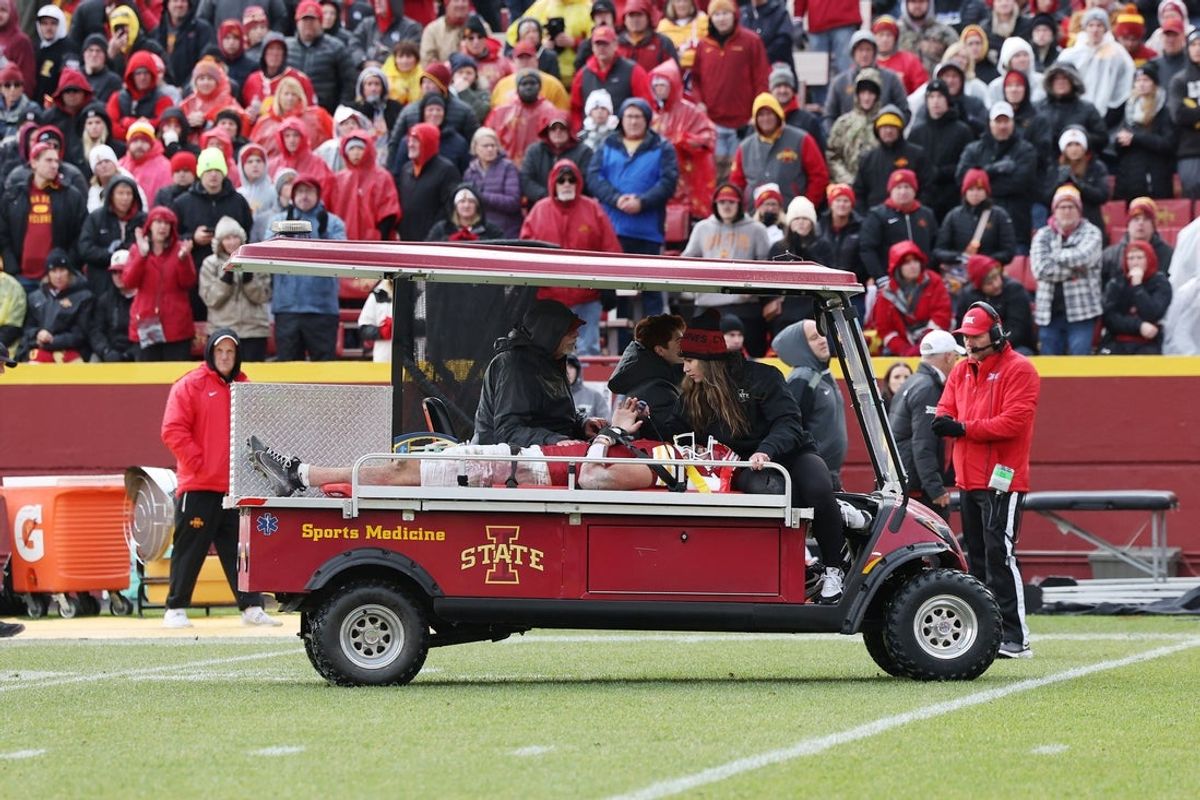 Nov 1, 2025; Ames, Iowa, USA; Iowa State Cyclones tight end Benjamin Brahmer (18) is driven off the field during their game with the Arizona State Sun Devils in the second half at Jack Trice Stadium. Mandatory Credit: Reese Strickland-Imagn Images