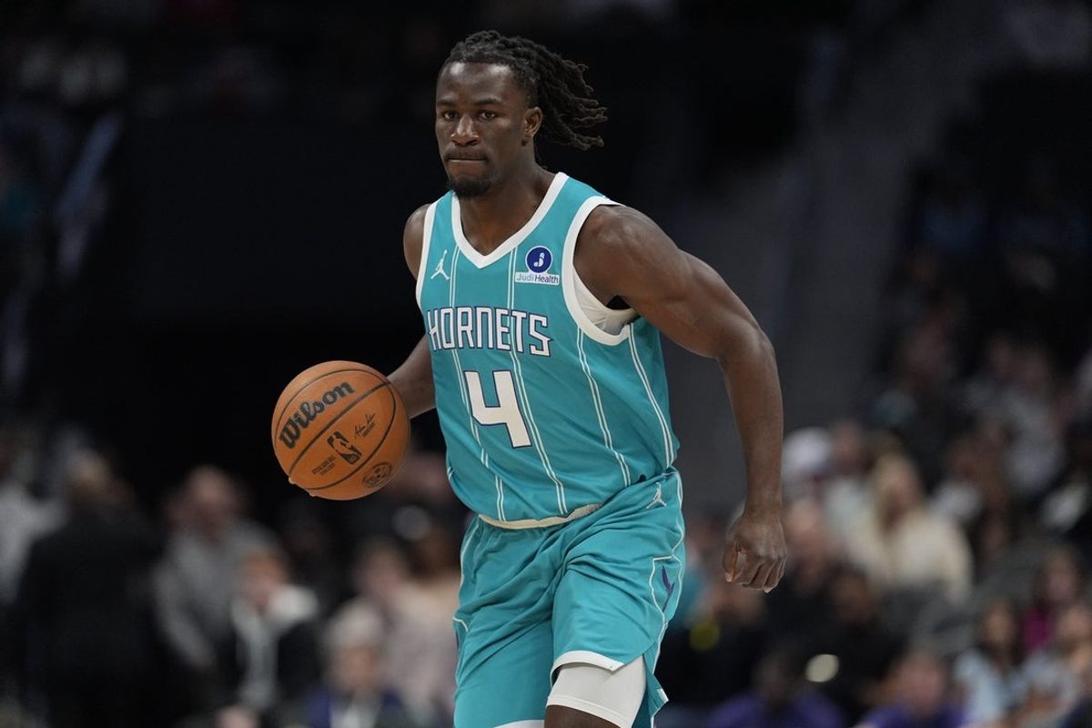 Nov 1, 2025; Charlotte, North Carolina, USA; Charlotte Hornets guard Sion James (4) brings the ball up court against the Minnesota Timberwolves during the first quarter at Spectrum Center. Mandatory Credit: Jim Dedmon-Imagn Images