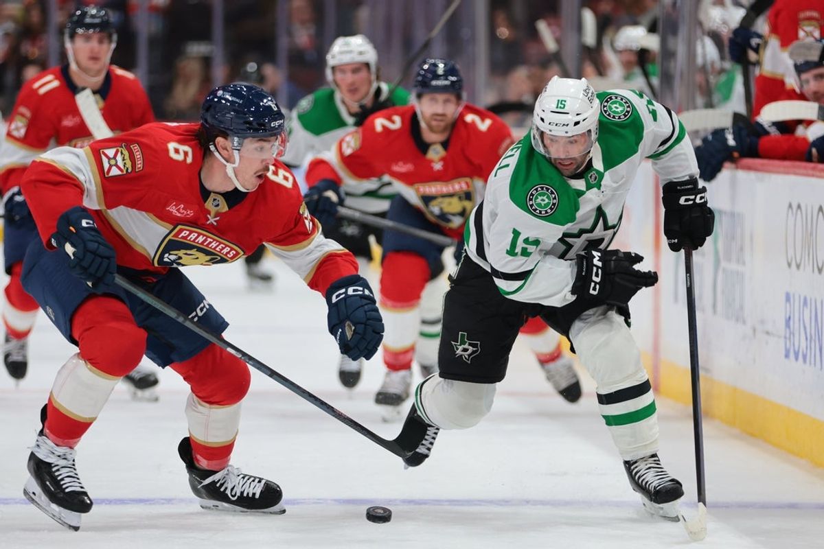 Nov 1, 2025; Sunrise, Florida, USA; Dallas Stars center Colin Blackwell (15) moves the puck against Florida Panthers defenseman Donovan Sebrango (6) during the first period at Amerant Bank Arena. Mandatory Credit: Sam Navarro-Imagn Images