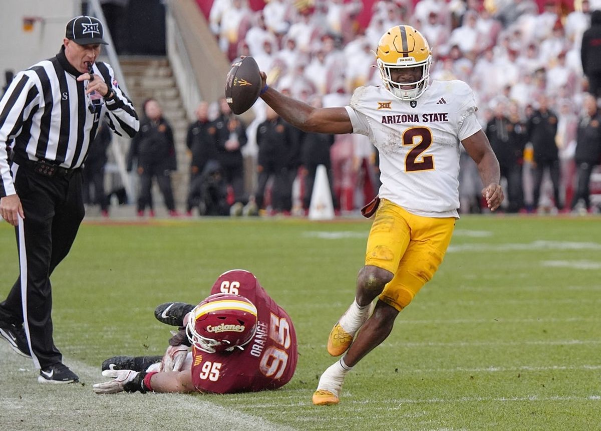 Arizona State Sun Devils quarterback Jeff Sims (2) breaks tackle from Iowa State Cyclones' defensive line Domonique Orange (95) and runs for a first down during the fourth quarter in the Big-12 showdown at jack Trice Stadium on Nov. 1, 2025, in Ames, Iowa.
