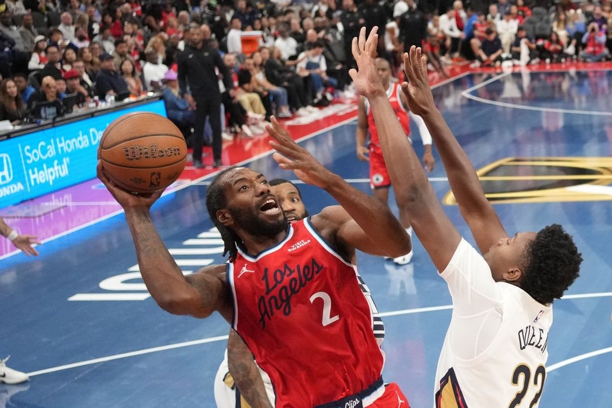 Oct 31, 2025; Inglewood, California, USA; LA Clippers forward Kawhi Leonard (2) shoots the ball against New Orleans Pelicans center Derik Queen (22) in the second half at Intuit Dome. Mandatory Credit: Kirby Lee-Imagn Images