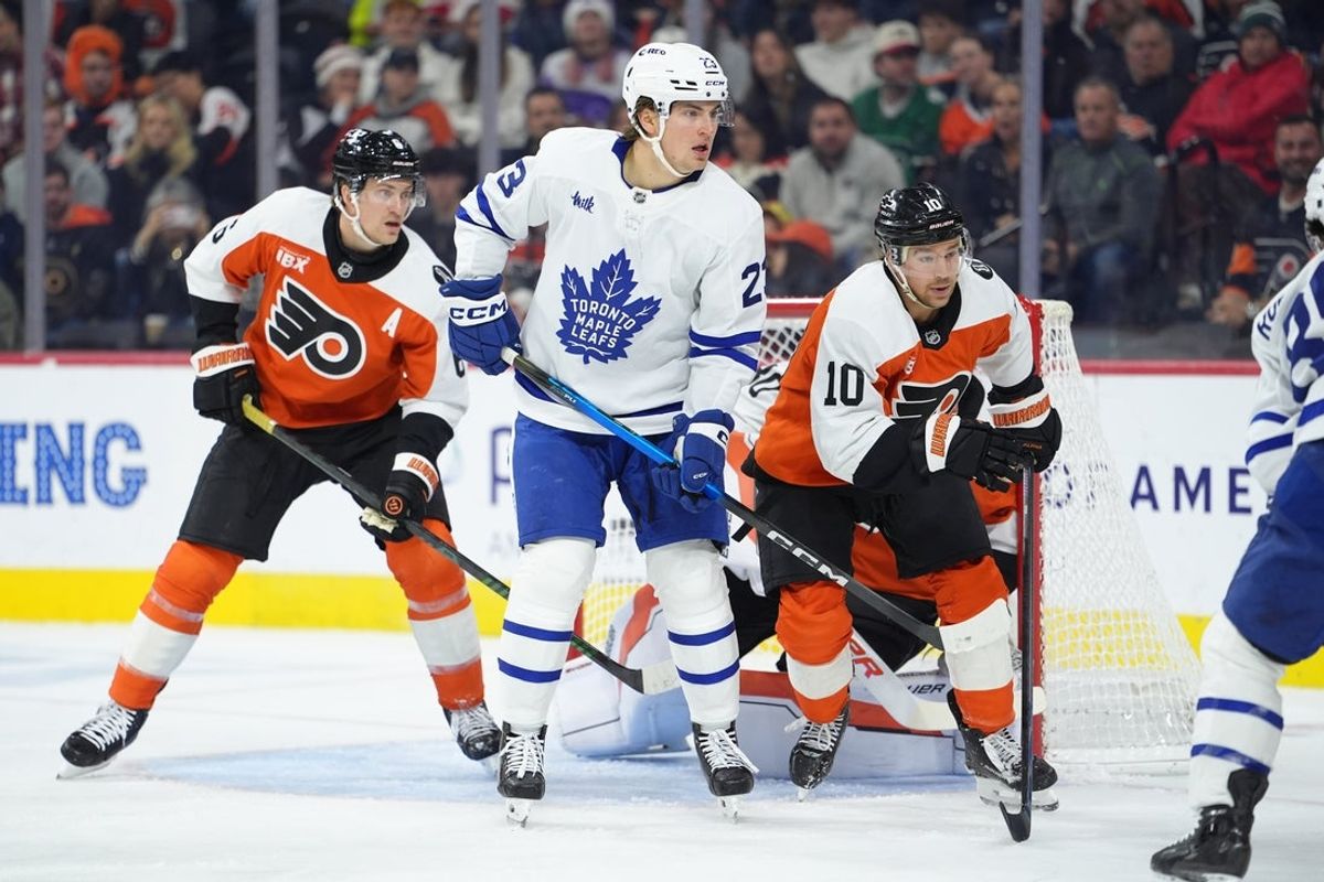 Nov 1, 2025; Philadelphia, Pennsylvania, USA; Toronto Maple Leafs left wing Matthew Knies (23) battles for position against Philadelphia Flyers right wing Bobby Brink (10) in the first period at Xfinity Mobile Arena. Mandatory Credit: Kyle Ross-Imagn Images