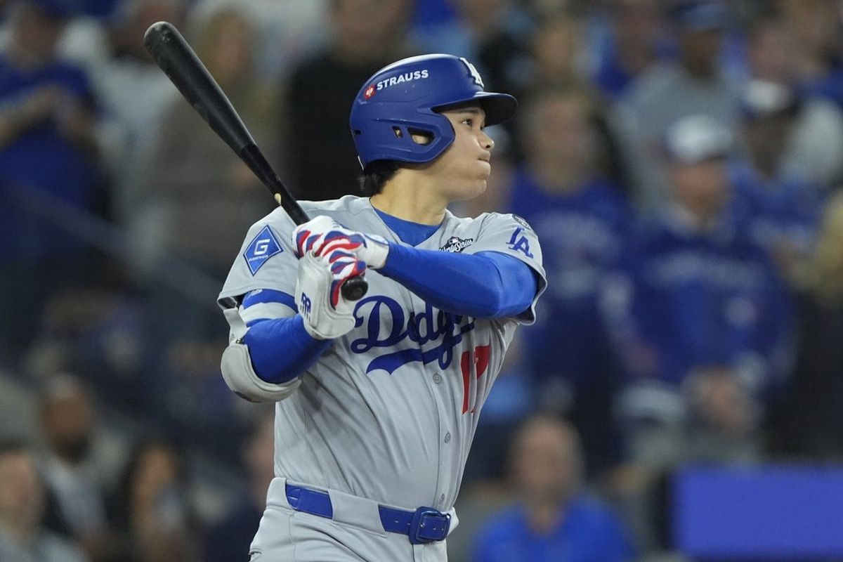 Nov 1, 2025; Toronto, Ontario, CAN; Los Angeles Dodgers two-way player Shohei Ohtani (17) hits a single against the Toronto Blue Jays in the first inning during game seven of the 2025 MLB World Series at Rogers Centre. Mandatory Credit: John E. Sokolowski-Imagn Images