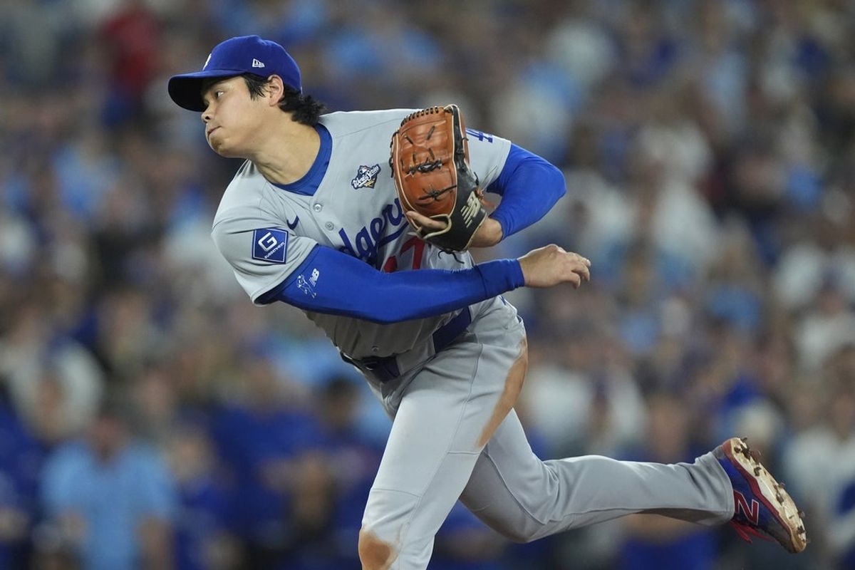 Nov 1, 2025; Toronto, Ontario, CAN; Los Angeles Dodgers two-way player Shohei Ohtani (17) pitches against the Toronto Blue Jays in the first inning during game seven of the 2025 MLB World Series at Rogers Centre. Mandatory Credit: John E. Sokolowski-Imagn Images