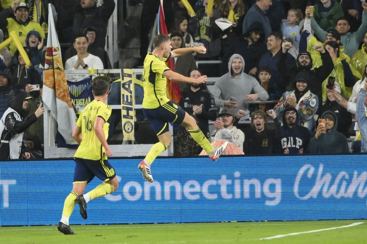 Nov 1, 2025; Nashville, Tennessee, USA;  Nashville SC defender Josh Bauer (22) celebrates his goal against Inter Miami during the first half at Geodis Park. Mandatory Credit: Steve Roberts-Imagn Images