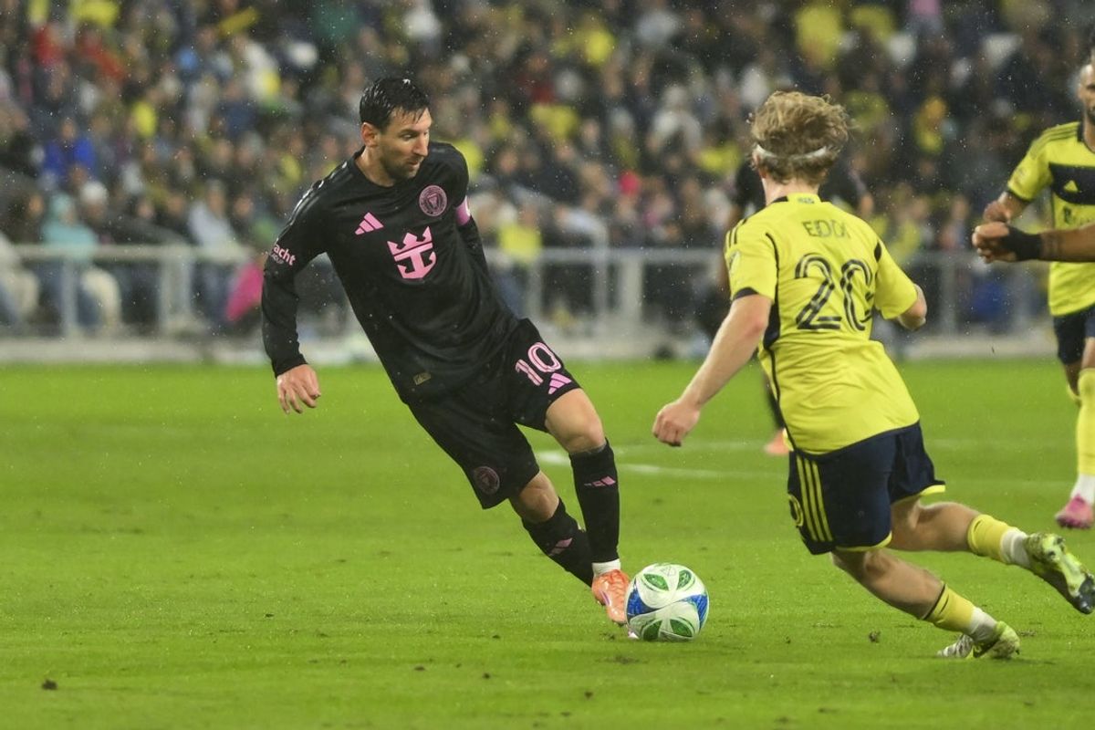 Nov 1, 2025; Nashville, Tennessee, USA;  Inter Miami forward Lionel Messi (10) dribbles the ball against Nashville SC during the first half at Geodis Park. Mandatory Credit: Steve Roberts-Imagn Images