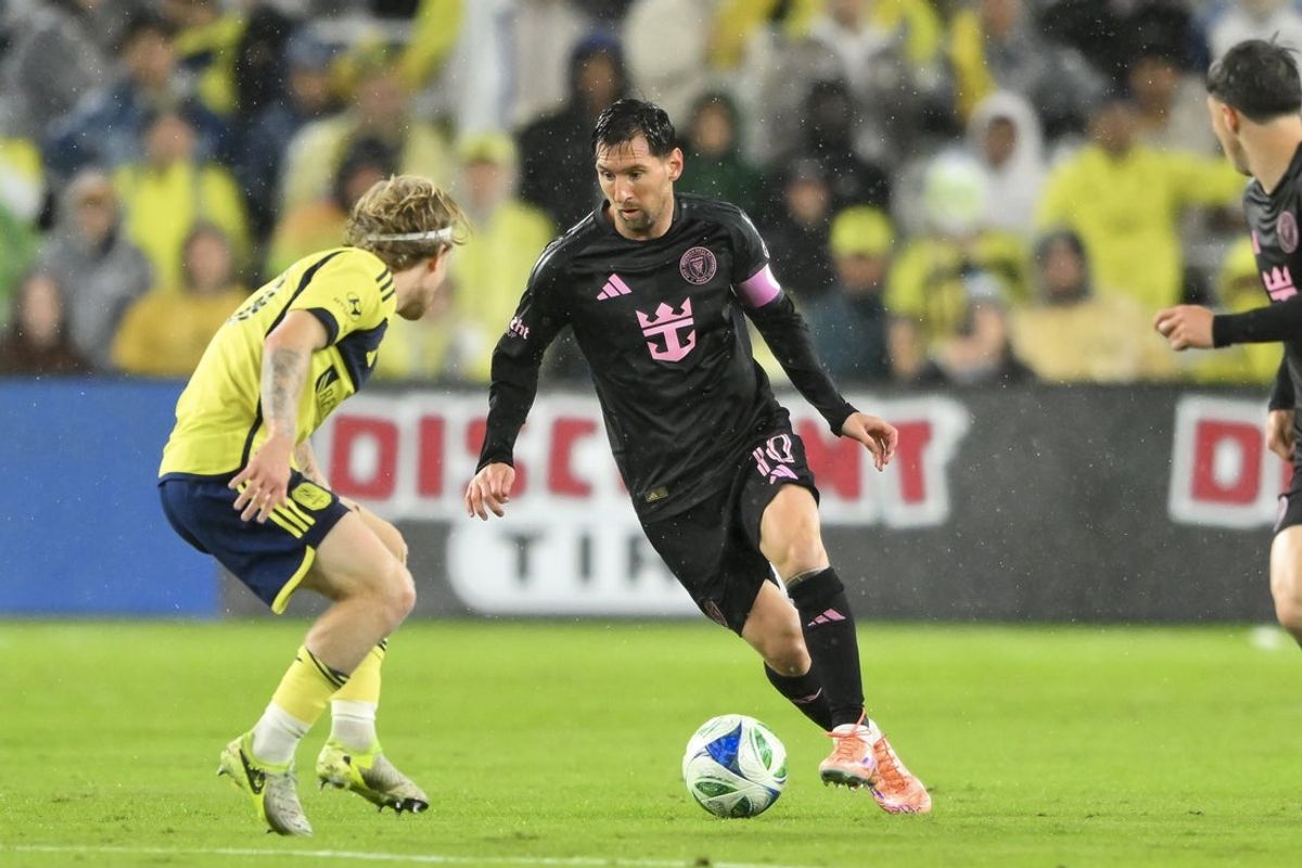 Nov 1, 2025; Nashville, Tennessee, USA;  Inter Miami forward Lionel Messi (10) dribbles the ball against Nashville SC during the first half at Geodis Park. Mandatory Credit: Steve Roberts-Imagn Images