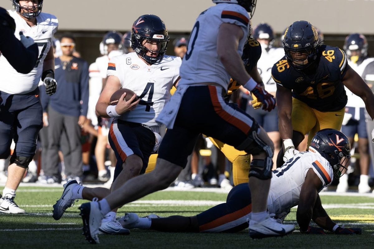 Nov 1, 2025; Berkeley, California, USA; Virginia Cavaliers quarterback Chandler Morris (4) carries the ball on a quarterback keeper against the California Golden Bears during the fourth quarter at California Memorial Stadium. Mandatory Credit: D. Ross Cameron-Imagn Images