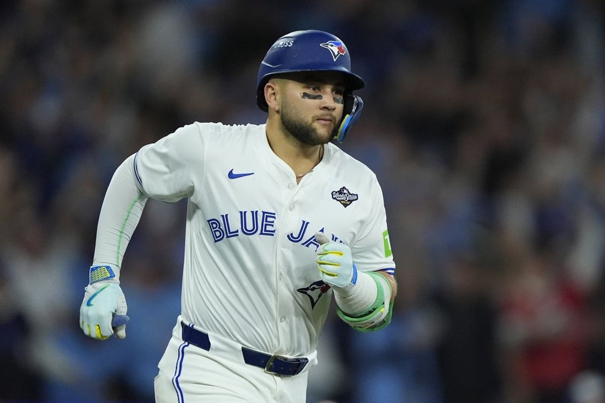 Nov 1, 2025; Toronto, Ontario, CAN; Toronto Blue Jays designated hitter Bo Bichette (11) runs after hitting a three run home run against the Los Angeles Dodgers in the third inning during game seven of the 2025 MLB World Series at Rogers Centre. Mandatory Credit: John E. Sokolowski-Imagn Images