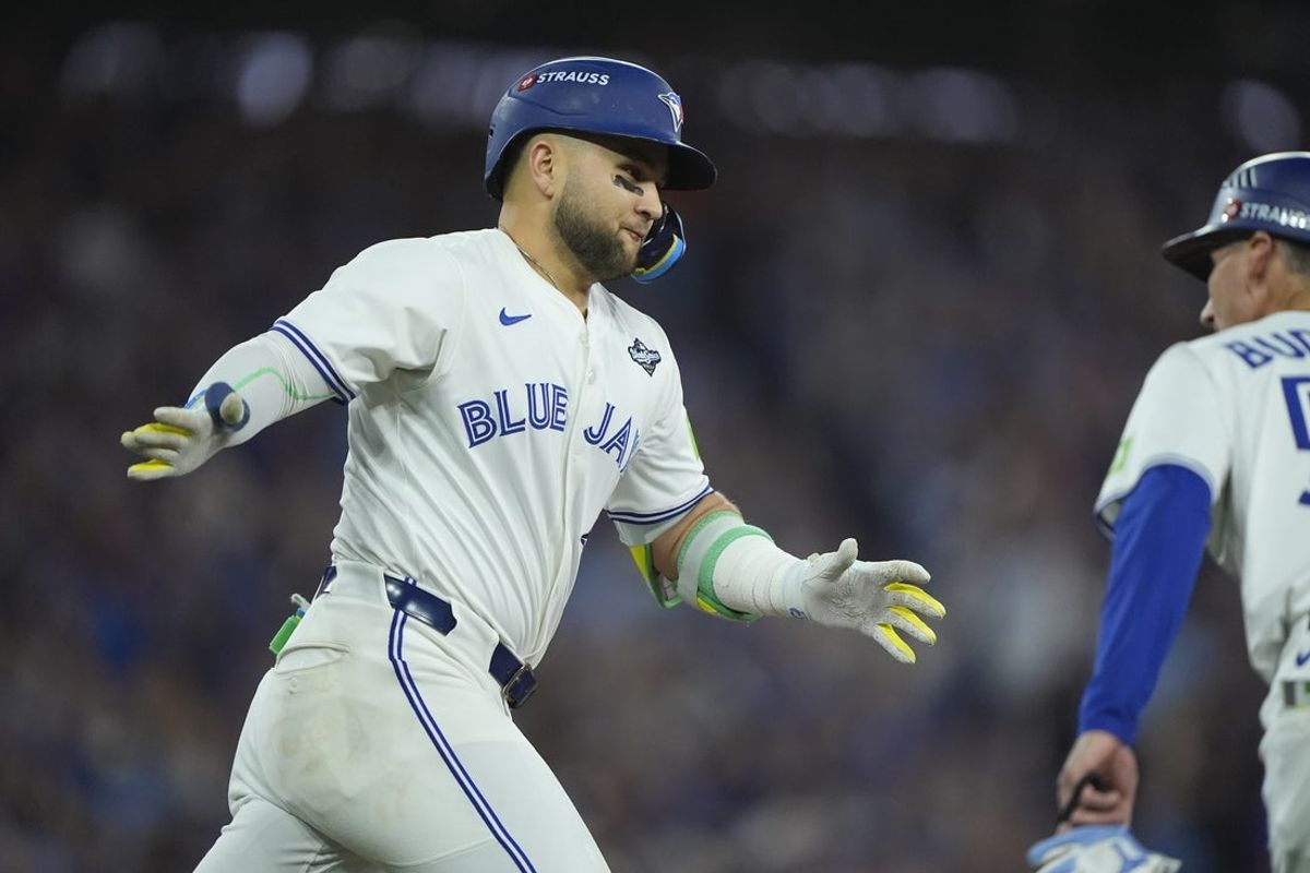 Nov 1, 2025; Toronto, Ontario, CAN; Toronto Blue Jays designated hitter Bo Bichette (11) reacts as he runs the bases after hitting a three run home run against the Los Angeles Dodgers in the third inning during game seven of the 2025 MLB World Series at Rogers Centre. Mandatory Credit: John E. Sokolowski-Imagn Images