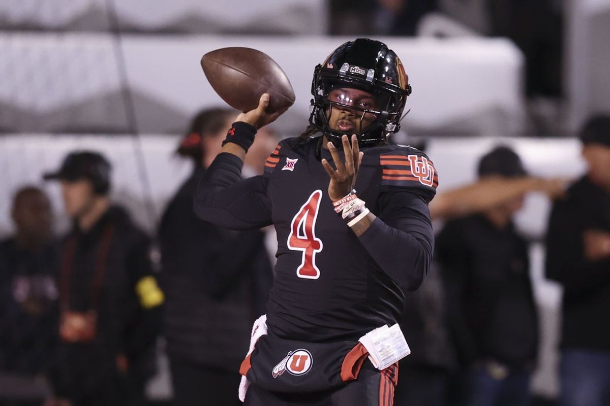 Nov 1, 2025; Salt Lake City, Utah, USA; Utah Utes quarterback Devon Dampier (4) warms up before the game against the Cincinnati Bearcats at Rice-Eccles Stadium. Mandatory Credit: Rob Gray-Imagn Images
