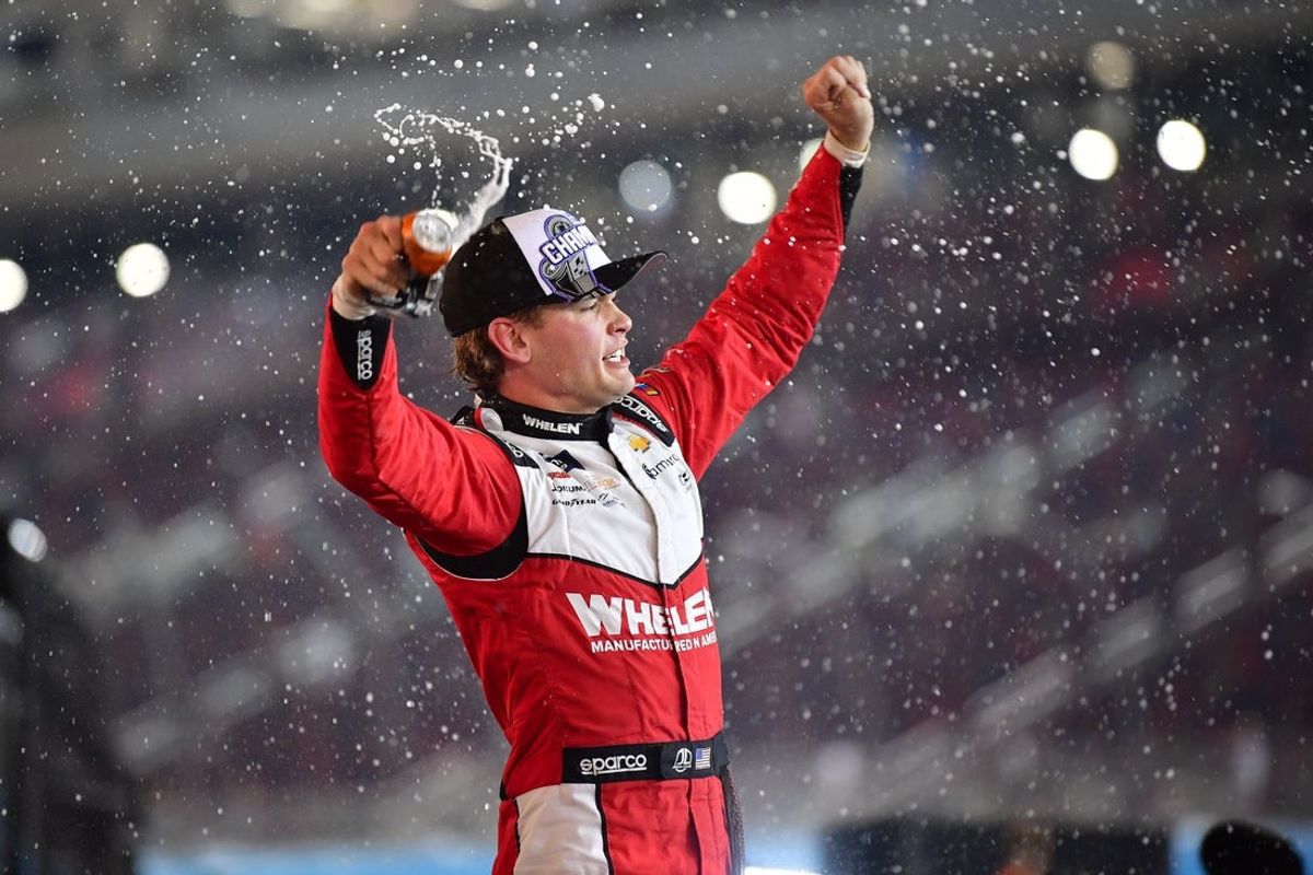Nov 1, 2025; Avondale, Arizona, USA; NASCAR Xfinity Series driver Jesse Love (2) celebrates his victory of the Xfinity Series Championship race at Phoenix Raceway. Mandatory Credit: Gary A. Vasquez-Imagn Images