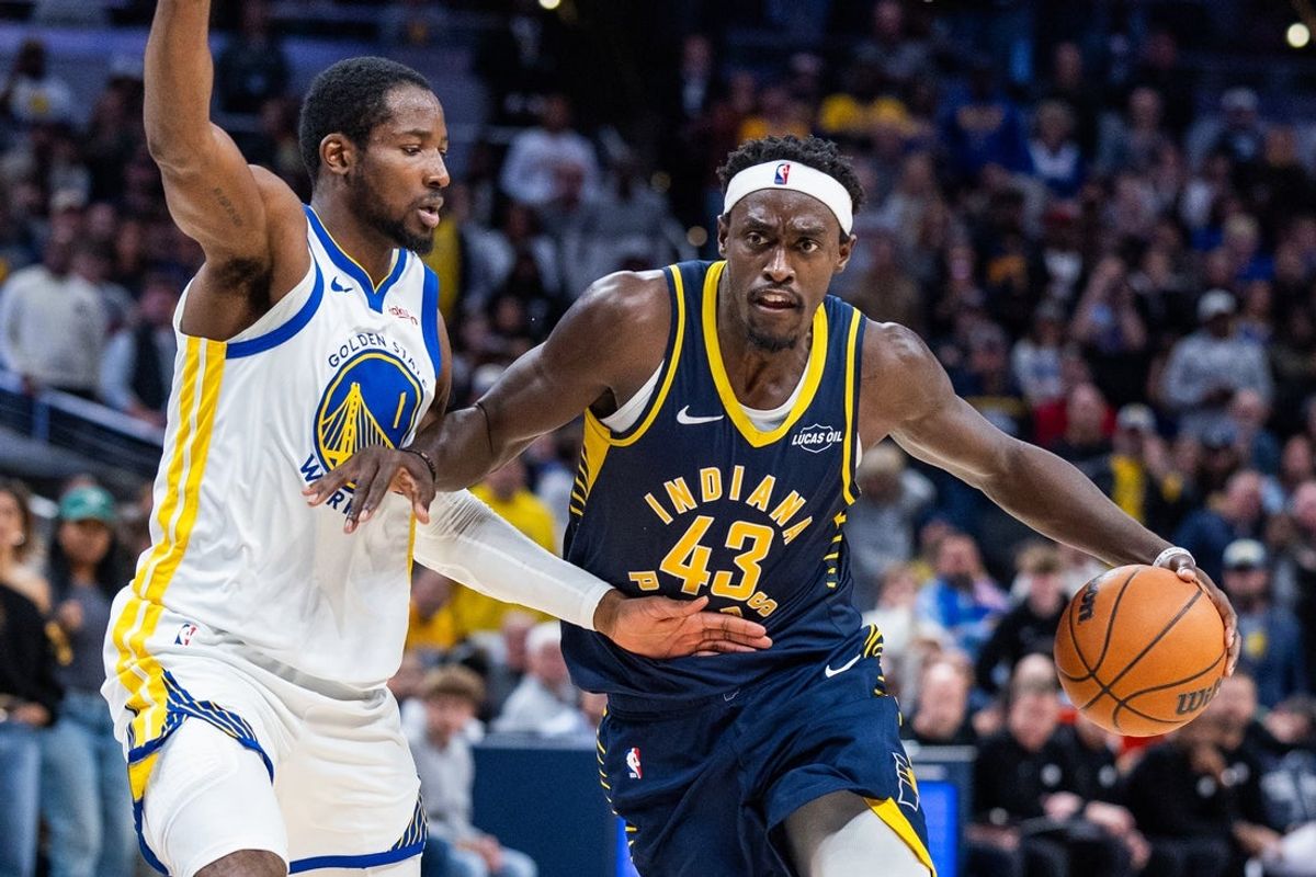 Nov 1, 2025; Indianapolis, Indiana, USA;  Indiana Pacers forward Pascal Siakam (43) dribbles the ball while  Golden State Warriors forward Jonathan Kuminga (1) defends in the second half  at Gainbridge Fieldhouse. Mandatory Credit: Trevor Ruszkowski-Imagn Images