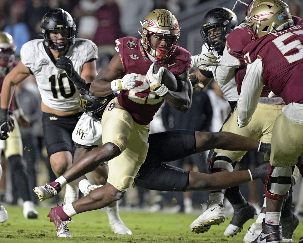 Nov 1, 2025; Tallahassee, Florida, USA; Florida State Seminoles running back Samuel Singleton Jr. (8) runs the ball during the second half against the Wake Forest Demon Deacons at Doak S. Campbell Stadium. Mandatory Credit: Melina Myers-Imagn Images
