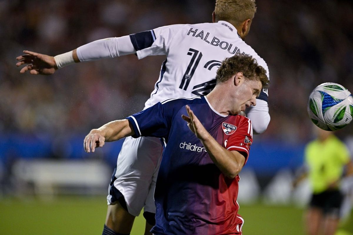 Nov 1, 2025; Frisco, Texas, USA; Vancouver Whitecaps defender Belal Halbouni (12) keeps the ball away from FC Dallas midfielder Christian Cappis (12) during the first half at Toyota Stadium. Mandatory Credit: Jerome Miron-Imagn Images