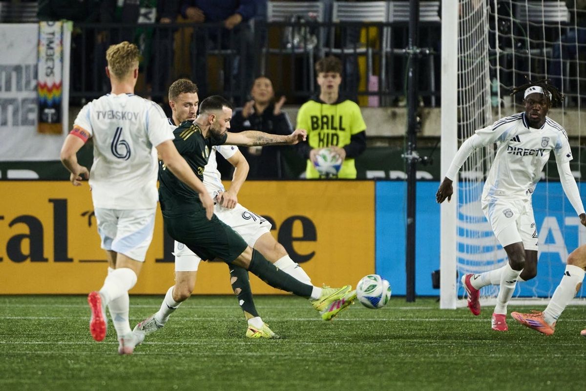 Nov 1, 2025; Portland, Oregon, USA; Portland Timbers midfielder Kristoffer Velde (99) scores a goal during the first half against San Diego FC defender Christopher McVey (97) at Providence Park. Mandatory Credit: Troy Wayrynen-Imagn Images