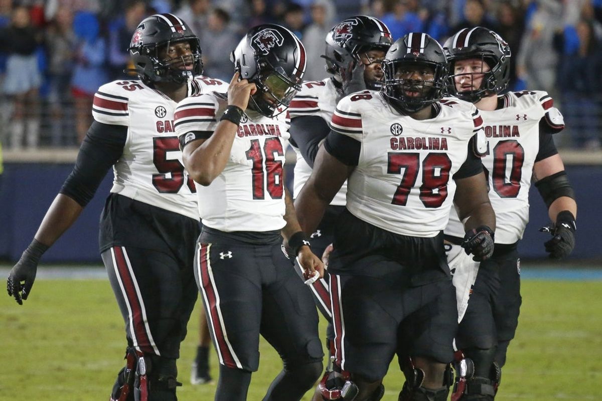 Nov 1, 2025; Oxford, Mississippi, USA; South Carolina Gamecocks quarterback LaNorris Sellers (16) and the rest of the offense walk off the field after a turnover during the fourth quarter against the Mississippi Rebels at Vaught-Hemingway Stadium. Mandatory Credit: Petre Thomas-Imagn Images