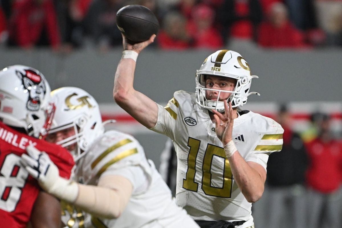 Nov 1, 2025; Raleigh, North Carolina, USA;  Georgia Tech Yellow Jackets quarterback Haynes King (10) throws a pass in the fourth quarter against the NC State Wolfpack at Carter-Finley Stadium. Mandatory Credit: Zachary Taft-Imagn Images
