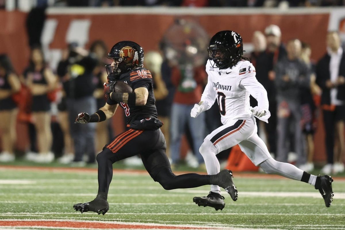 Nov 1, 2025; Salt Lake City, Utah, USA; Utah Utes wide receiver Ryan Davis (9) runs after a catch against Cincinnati Bearcats cornerback Matthew McDoom (0) during the first quarter at Rice-Eccles Stadium. Mandatory Credit: Rob Gray-Imagn Images