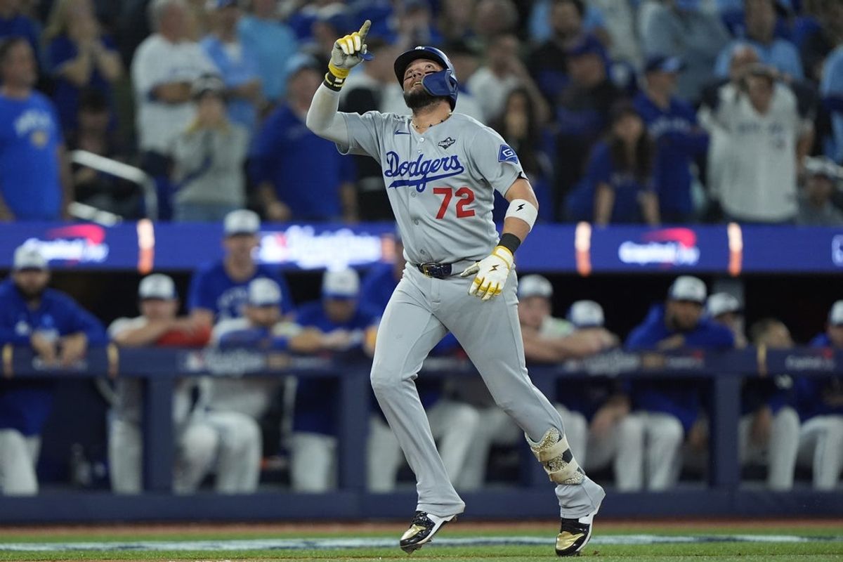 Nov 1, 2025; Toronto, Ontario, CAN; Los Angeles Dodgers second baseman Miguel Rojas (72) celebrates as he runs the bases after hitting a home run against the Toronto Blue Jays in the ninth inning during game seven of the 2025 MLB World Series at Rogers Centre. Mandatory Credit: John E. Sokolowski-Imagn Images