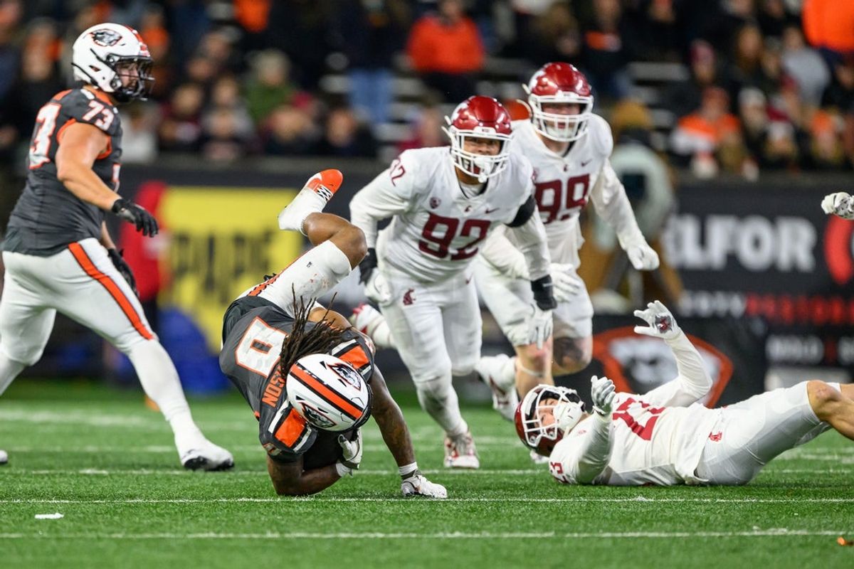 Nov 1, 2025; Corvallis, Oregon, USA; Oregon State Beavers running back Anthony Hankerson (0) is tackled by Washington State Cougars safety Matthew Durrance (23) during the fourth quarter at Reser Stadium. Mandatory Credit: Craig Strobeck-Imagn Images