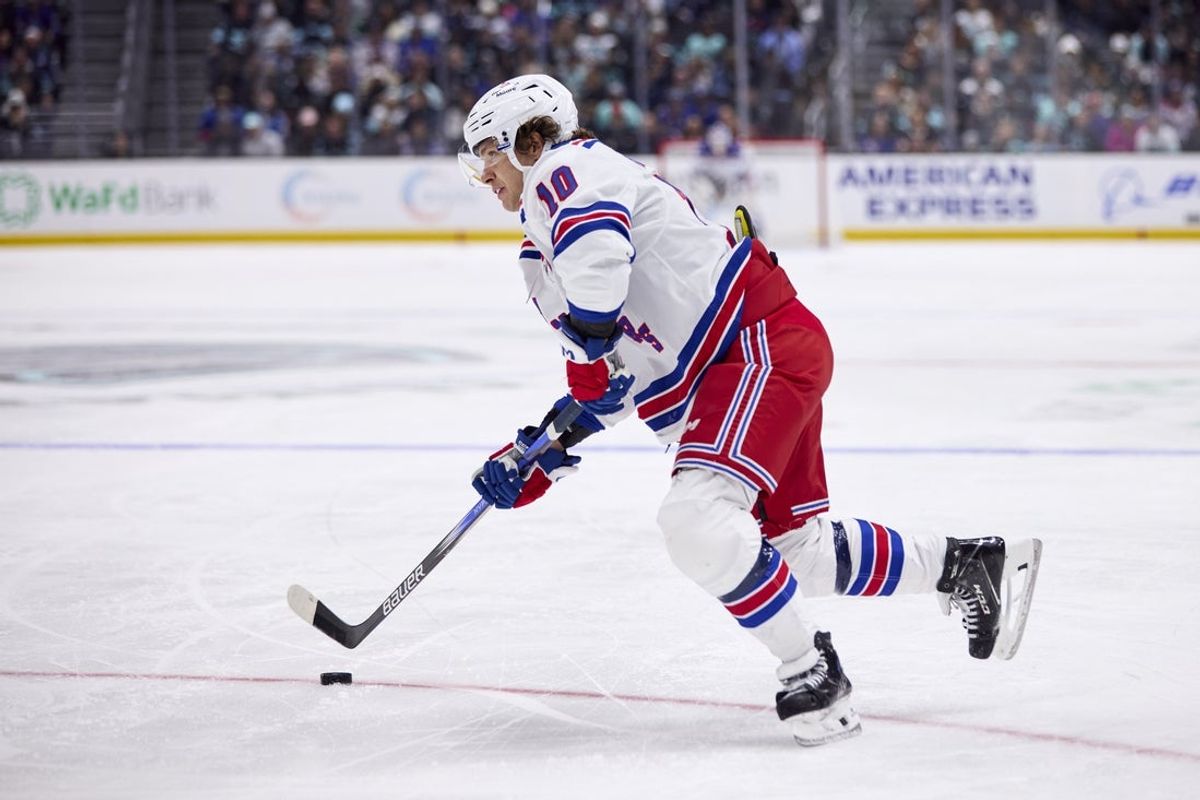 Nov 1, 2025; Seattle, Washington, USA; New York Rangers left wing Artemi Panarin (10) looks to take a shot on goal during the second period against the Seattle Kraken at Climate Pledge Arena. Mandatory Credit: Blake Dahlin-Imagn Images