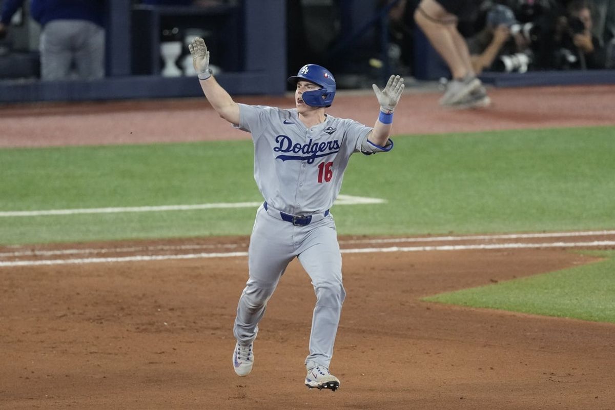 Nov 1, 2025; Toronto, Ontario, CAN; Los Angeles Dodgers catcher Will Smith (16) runs after hitting a home run against the Toronto Blue Jays in the eleventh inning during game seven of the 2025 MLB World Series at Rogers Centre. Mandatory Credit: Kevin Sousa-Imagn Images