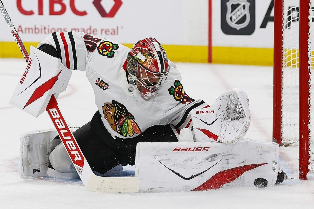 Nov 1, 2025; Edmonton, Alberta, CAN; Chicago Blackhawks goaltender Spencer Knight (30) makes a save on Edmonton Oilers forward Leon Draisaitl (29) (not shown) during the third period at Rogers Place. Mandatory Credit: Perry Nelson-Imagn Images