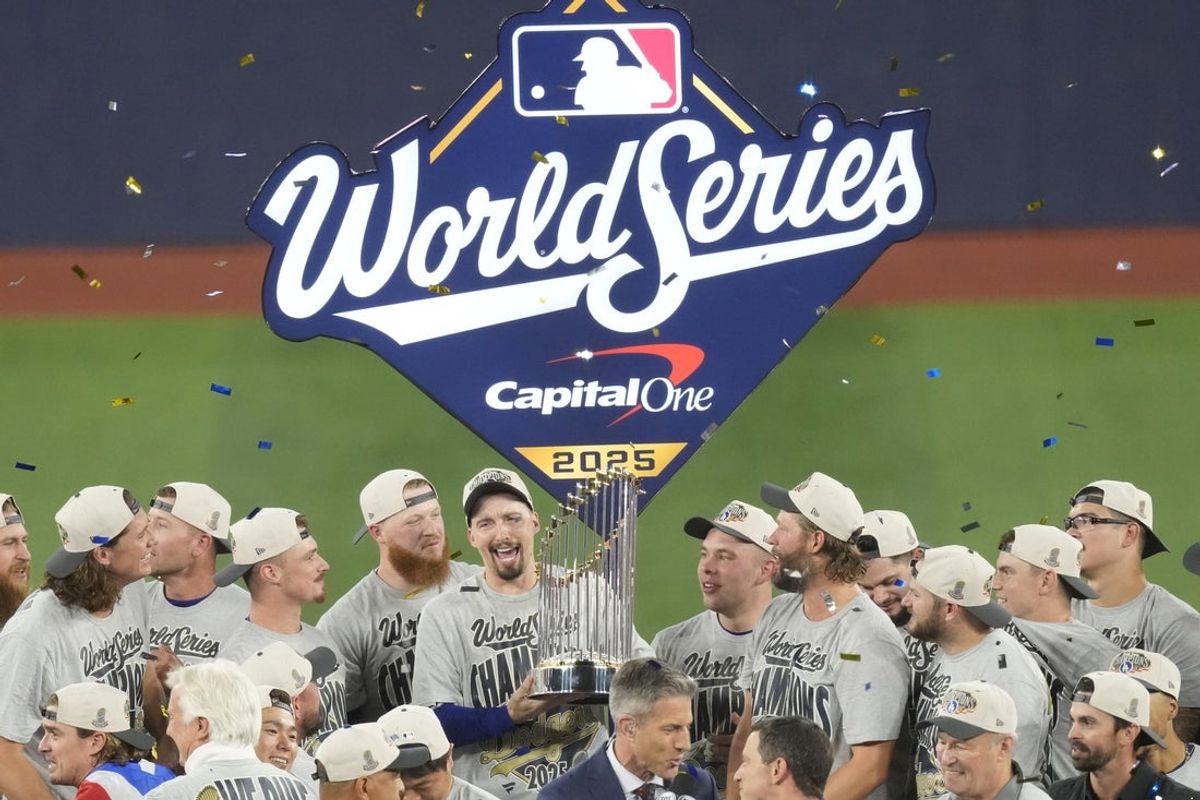 Nov 1, 2025; Toronto, Ontario, CAN; Los Angeles Dodgers pitcher Blake Snell (7) celebrates with the Commissioner's Trophy after defeating the Toronto Blue Jays in game seven of the 2025 MLB World Series at Rogers Centre. Mandatory Credit: Kevin Sousa-Imagn Images