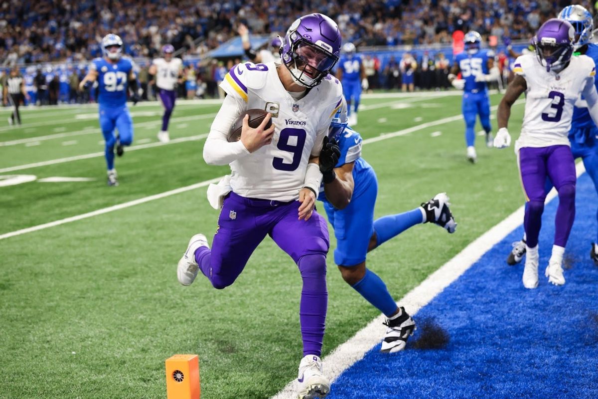 Nov 2, 2025; Detroit, Michigan, USA; Minnesota Vikings quarterback J.J. McCarthy (9) runs the ball for a touchdown in the third quarter against the Detroit Lions at Ford Field. Mandatory Credit: David Reginek-Imagn Images