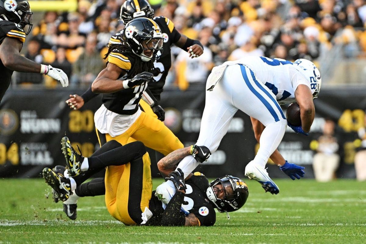 Nov 2, 2025; Pittsburgh, Pennsylvania, USA; Pittsburgh Steelers cornerback Darius Slay (23) tackles Indianapolis Colts running back Jonathan Taylor (28) during the second half at Acrisure Stadium. Mandatory Credit: Barry Reeger-Imagn Images