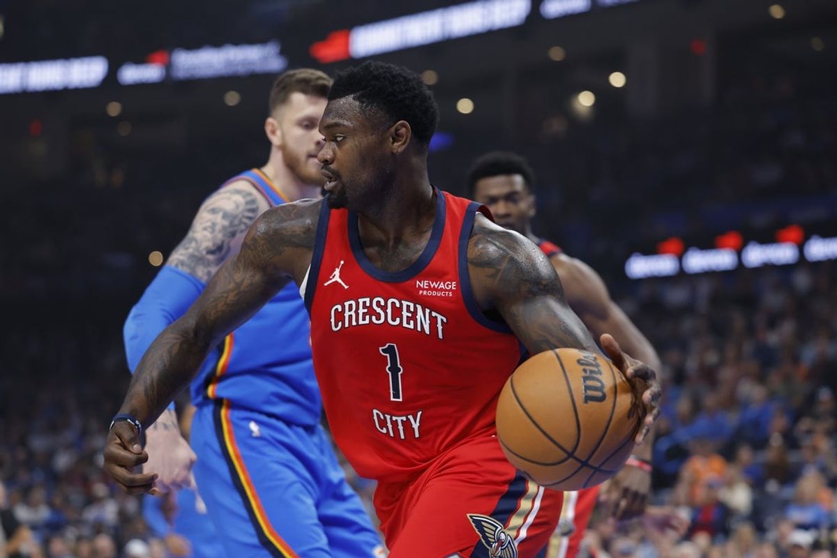 Nov 2, 2025; Oklahoma City, Oklahoma, USA;New Orleans Pelicans forward Zion Williamson (1) moves the ball around Oklahoma City Thunder center Isaiah Hartenstein (55) after a rebound during the first quarter at Paycom Center. Mandatory Credit: Alonzo Adams-Imagn Images