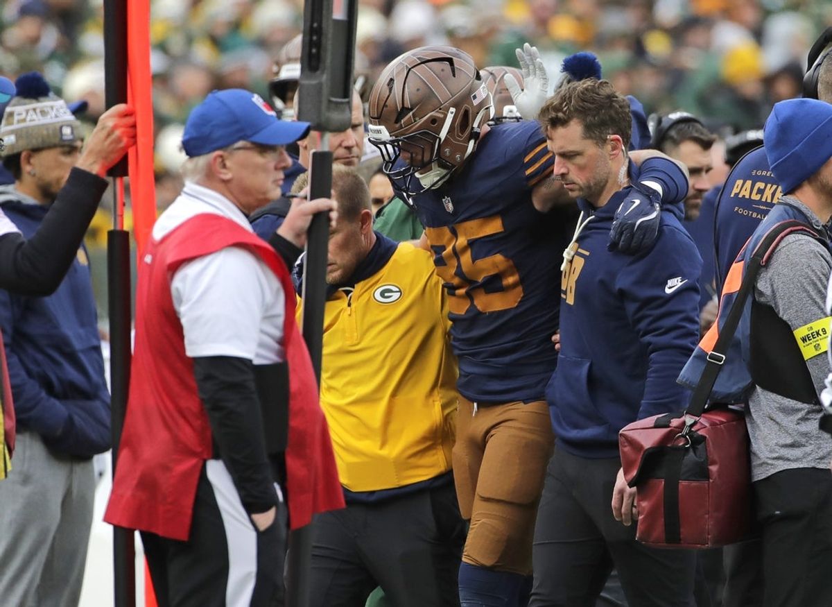Nov 2, 2025; Green Bay, Wisconsin, USA; Green Bay Packers tight end Tucker Kraft (85) is assisted off the field after getting injured against the Carolina Panthers during their football game at Lambeau Field. Mandatory Credit: Dan Powers-USA TODAY Network via Imagn Images