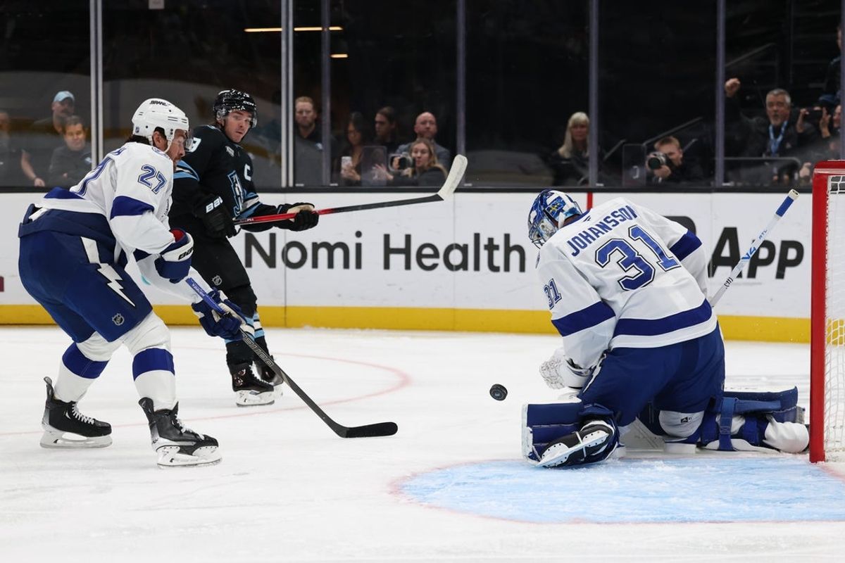 Nov 2, 2025; Salt Lake City, Utah, USA; Utah Mammoth right wing Clayton Keller (9) takes a shot against Tampa Bay Lightning goaltender Jonas Johansson (31) with defenseman Ryan McDonagh (27) defending during the first period at Delta Center. Mandatory Credit: Rob Gray-Imagn Images