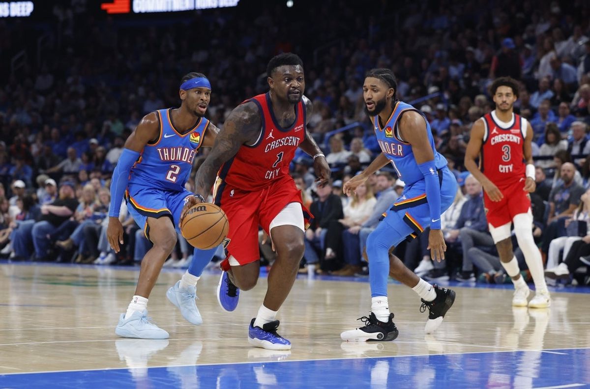 Nov 2, 2025; Oklahoma City, Oklahoma, USA; New Orleans Pelicans forward Zion Williamson (1) drives to the basket past Oklahoma City Thunder guard Shai Gilgeous-Alexander (2) and guard Isaiah Joe (11) during the second half at Paycom Center. Mandatory Credit: Alonzo Adams-Imagn Images