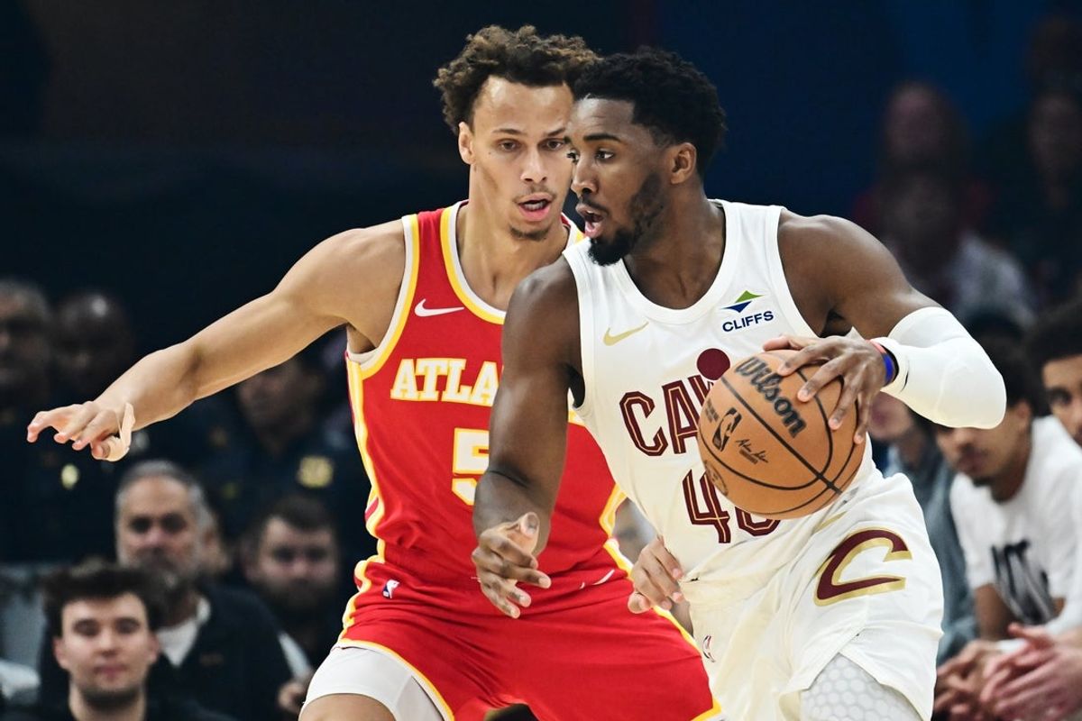 Nov 2, 2025; Cleveland, Ohio, USA; Cleveland Cavaliers guard Donovan Mitchell (45) drives to the basket against Atlanta Hawks guard Dyson Daniels (5) during the first quarter at Rocket Arena. Mandatory Credit: Ken Blaze-Imagn Images