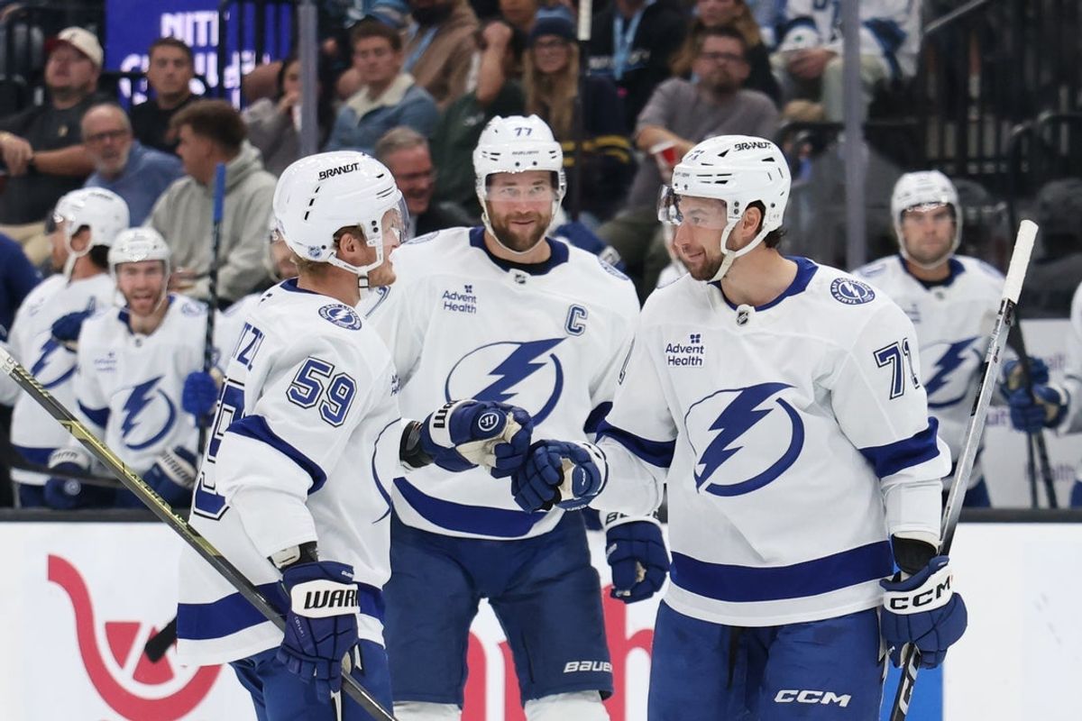 Nov 2, 2025; Salt Lake City, Utah, USA; Tampa Bay Lightning center Anthony Cirelli (71) celebrates scoring a goal against the Utah Mammoth during the second period with center Jake Guentzel (59) and defenseman Victor Hedman (77) at Delta Center. Mandatory Credit: Rob Gray-Imagn Images