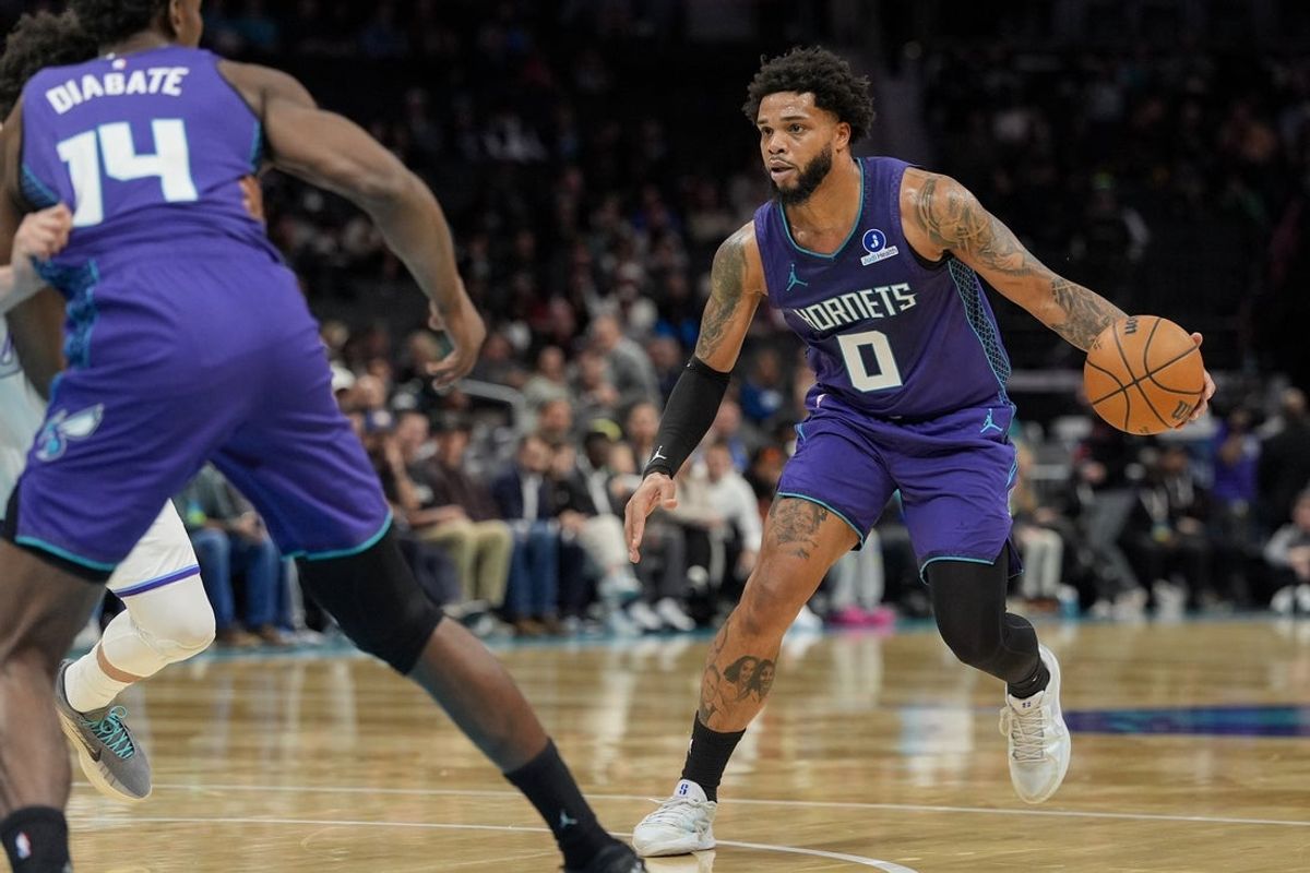 Nov 2, 2025; Charlotte, North Carolina, USA; Charlotte Hornets forward Miles Bridges (0) drives to the basket against the Utah Jazz during the first quarter at Spectrum Center. Mandatory Credit: Jim Dedmon-Imagn Images
