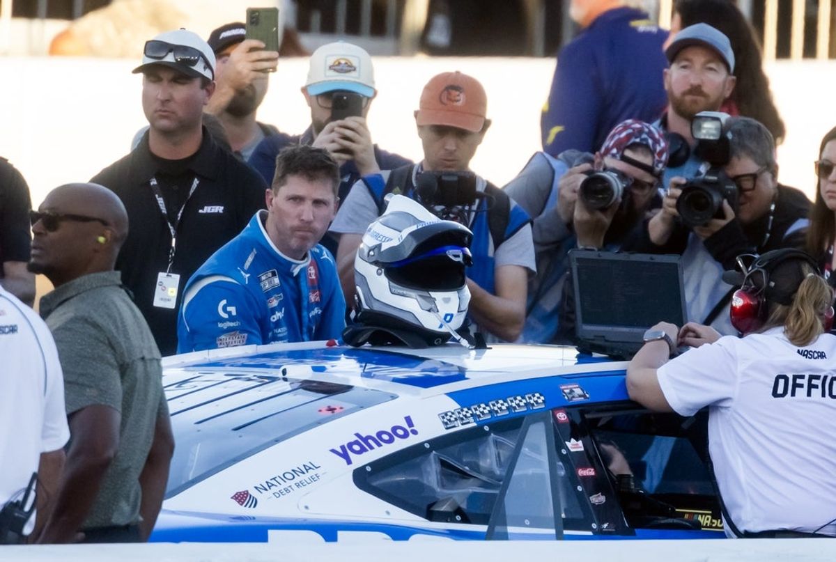 Nov 2, 2025; Avondale, Arizona, USA; NASCAR Cup Series driver Denny Hamlin (11) reacts after climnbing out of his car following the NASCAR Championship race at Phoenix Raceway. Mandatory Credit: Mark J. Rebilas-Imagn Images
