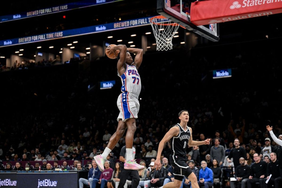Nov 2, 2025; Brooklyn, New York, USA; Philadelphia 76ers guard VJ Edgecombe (77) dunks the ball as Brooklyn Nets guard Egor Demin (8) trails during the first half at Barclays Center. Mandatory Credit: John Jones-Imagn Images