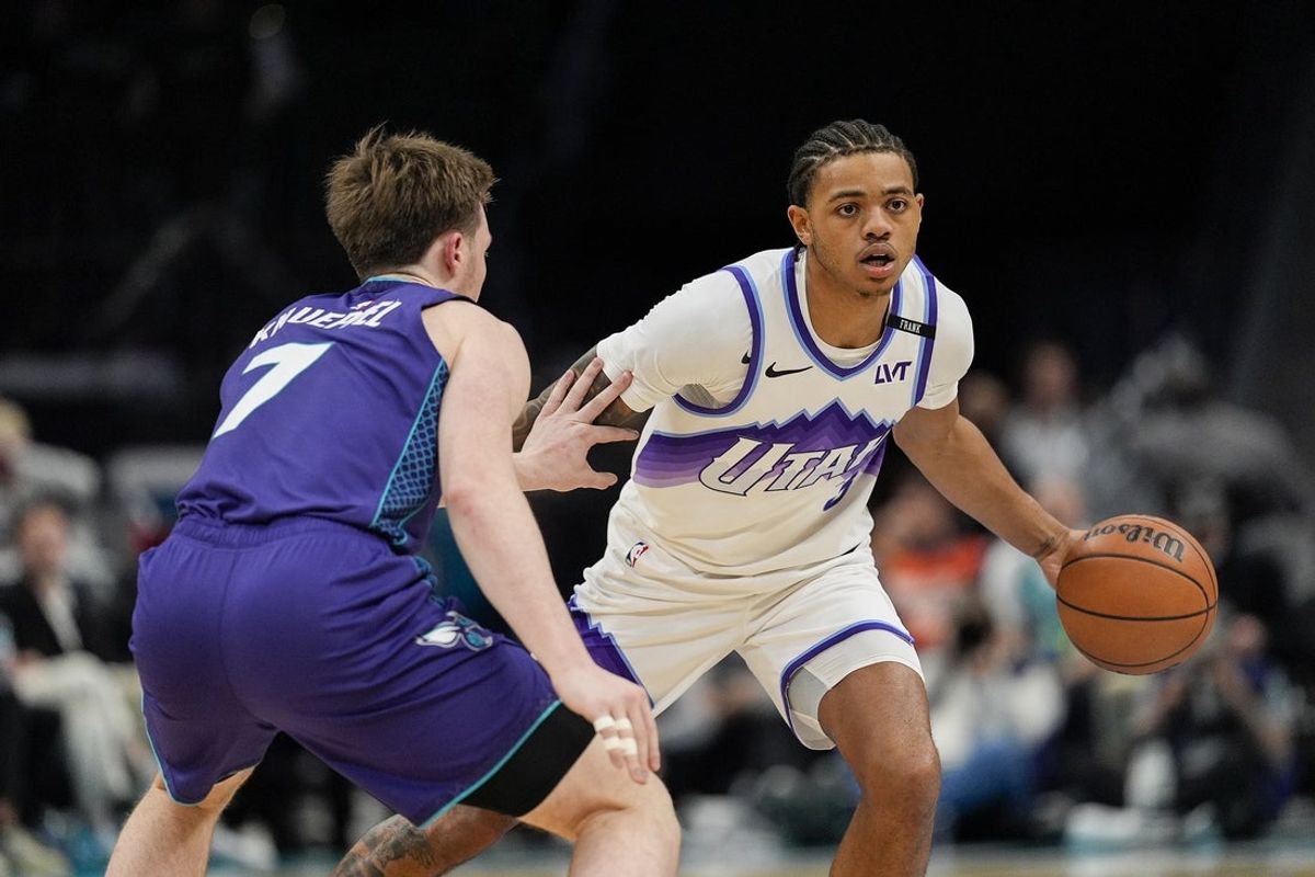 Nov 2, 2025; Charlotte, North Carolina, USA; Utah Jazz guard Keyonte George (3) handles the ball against Charlotte Hornets guard Kon Knueppel (7) during the second half at Spectrum Center. Mandatory Credit: Jim Dedmon-Imagn Images