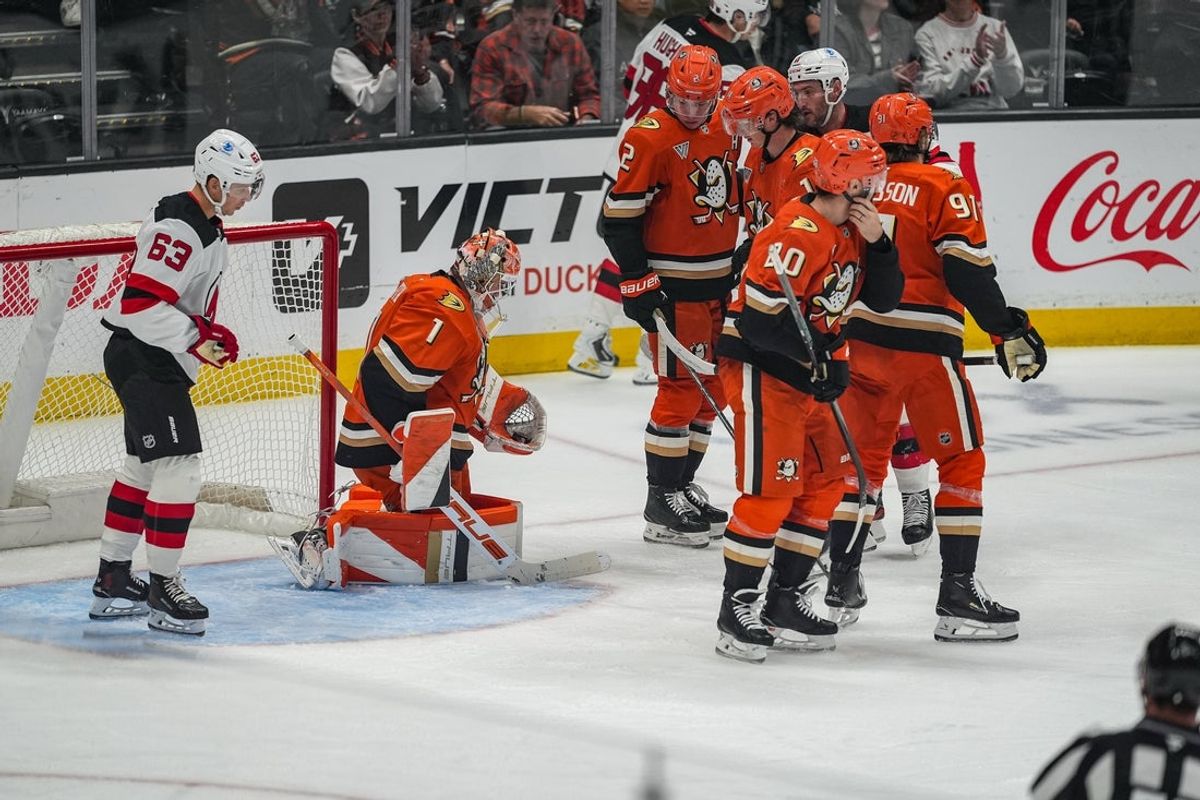Nov 2, 2025; Anaheim, California, USA; Anaheim Ducks goaltender Lukas Dostal (1) with a save against the New Jersey Devils during the second period at Honda Center. Mandatory Credit: Corinne Votaw-Imagn Images